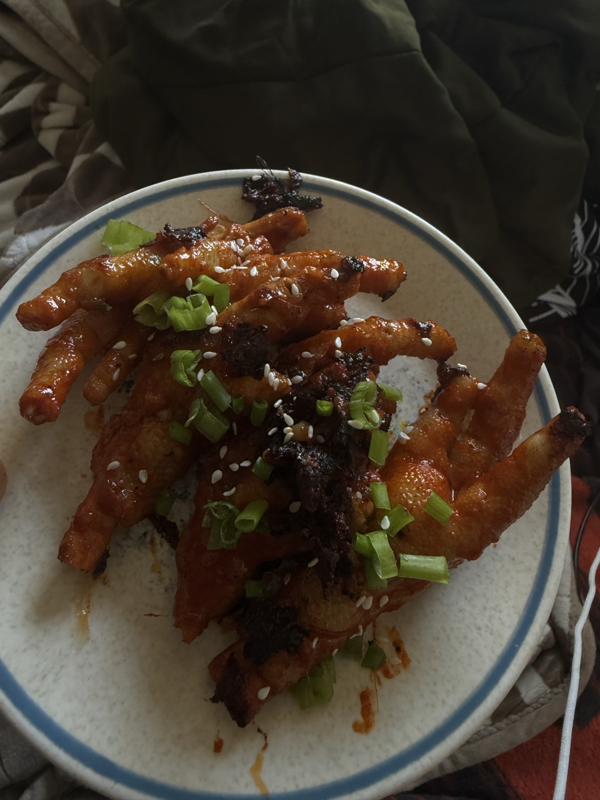 Spicy Korean chicken feet glazed with sesame and scallions